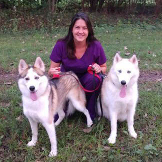 Ashley with her two huskies