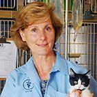 Dr. Moran holding a tuxedo cat