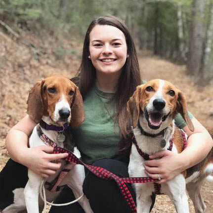 Morgan with her dogs in the woods